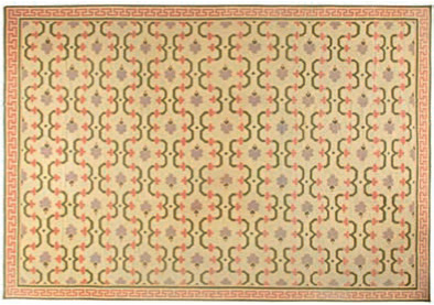 An example of a contemporary Pakistan flat weave rug with floro-geometric styling and varying colors. 6’ × 9’